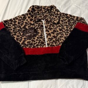 Cheetah show pig fleece with Red and Black Accents. Size XS